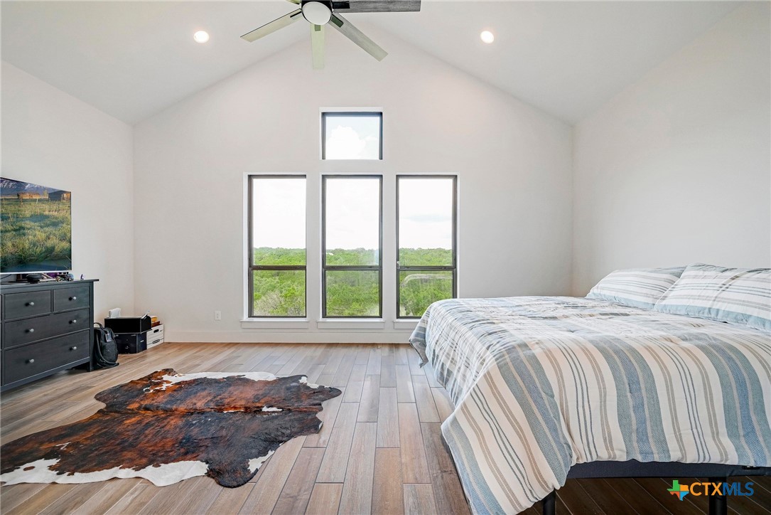 132 Lambs Ear Path San Marcos, TX 78666 - Photo 16 of 43 a bed sitting in a bedroom next to a window