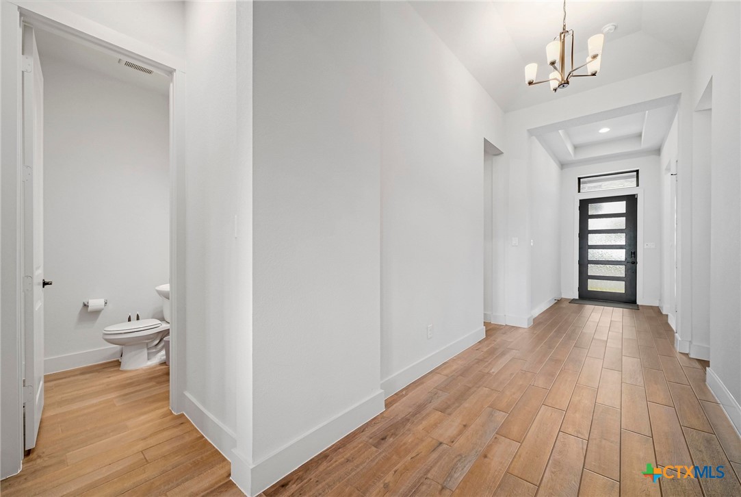 132 Lambs Ear Path San Marcos, TX 78666 - Photo 22 of 43 a view of a room with wooden floor and bathroom