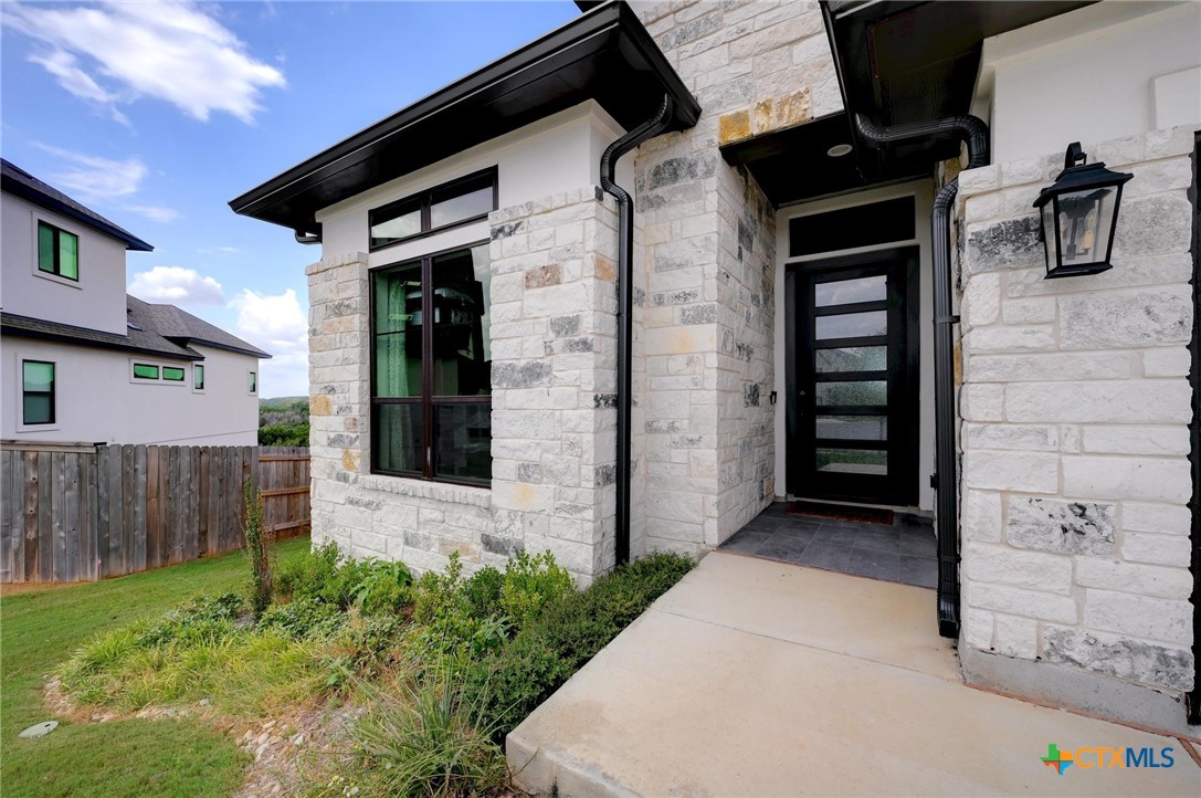132 Lambs Ear Path San Marcos, TX 78666 - Photo 5 of 43 front view of a house with a yard