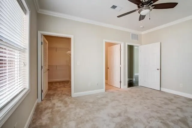 a view of an empty room and a window