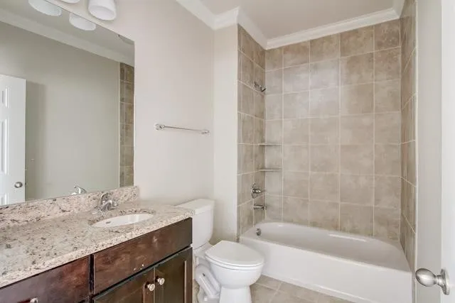 a bathroom with a granite countertop sink a toilet and shower