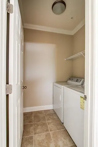 a view of bathroom with washer and dryer