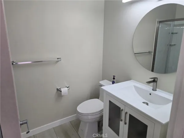 a bathroom with a glass shower door