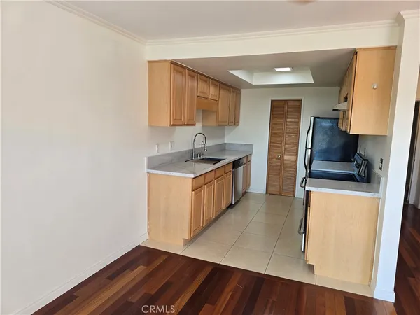a view of an empty room and wooden floor