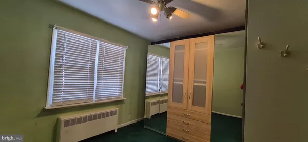 a view of a hardwood and utility room
