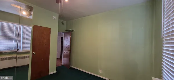 a bathroom with a shower and a sink
