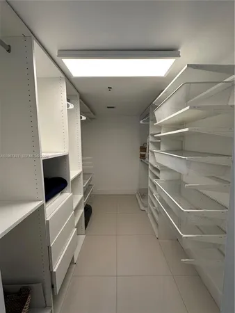 a view of an empty walk in closet