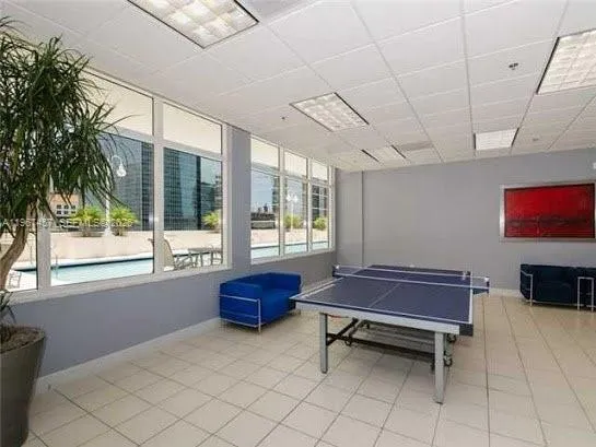a room with gym equipment and a large window