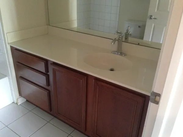a bathroom with a sink and mirror
