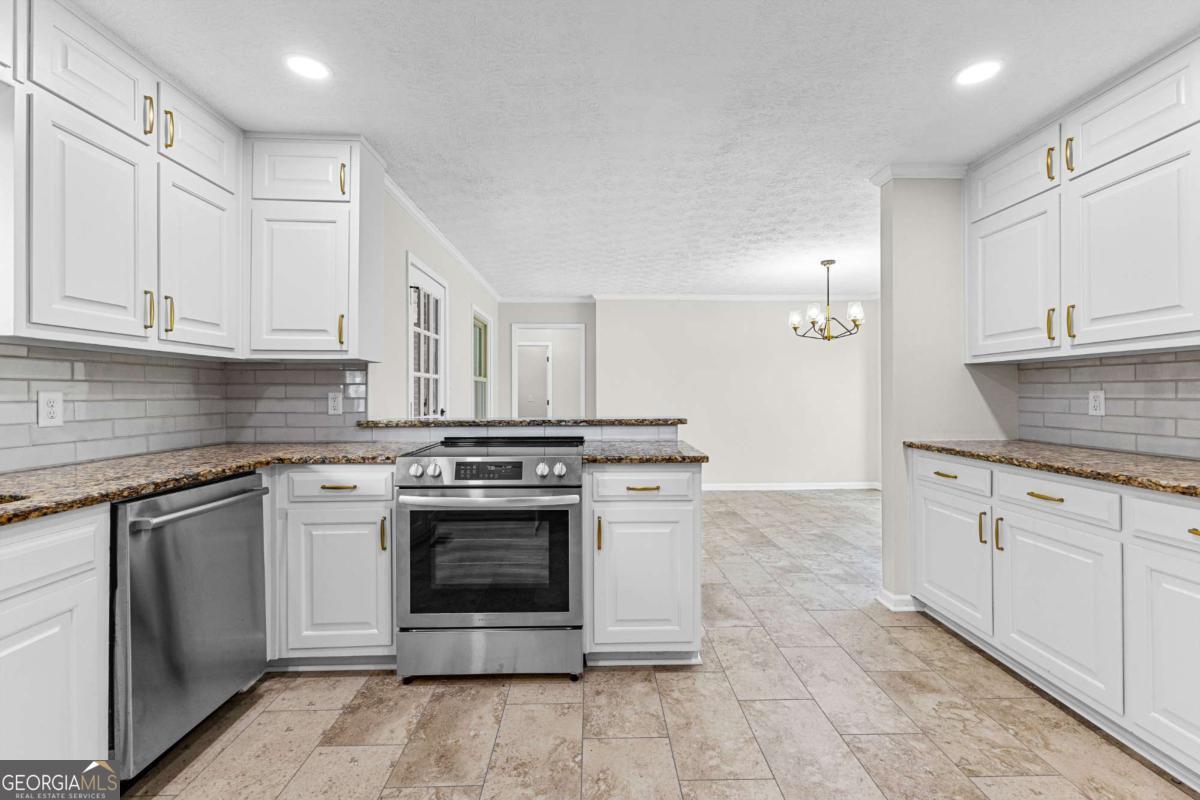 550 Davis Road Fayetteville, GA 30215 - Photo 20 of 75 a kitchen with cabinets appliances and a sink