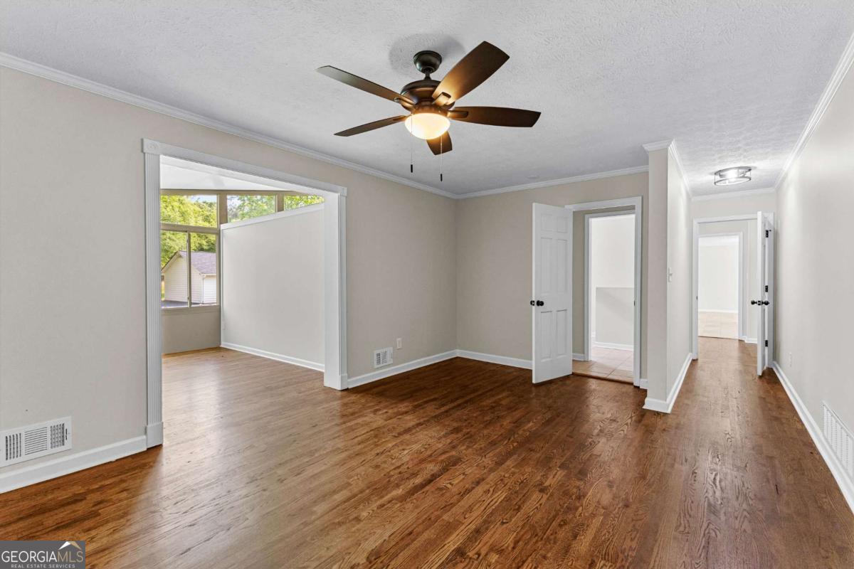 550 Davis Road Fayetteville, GA 30215 - Photo 35 of 75 a view of an empty room with wooden floor and a window