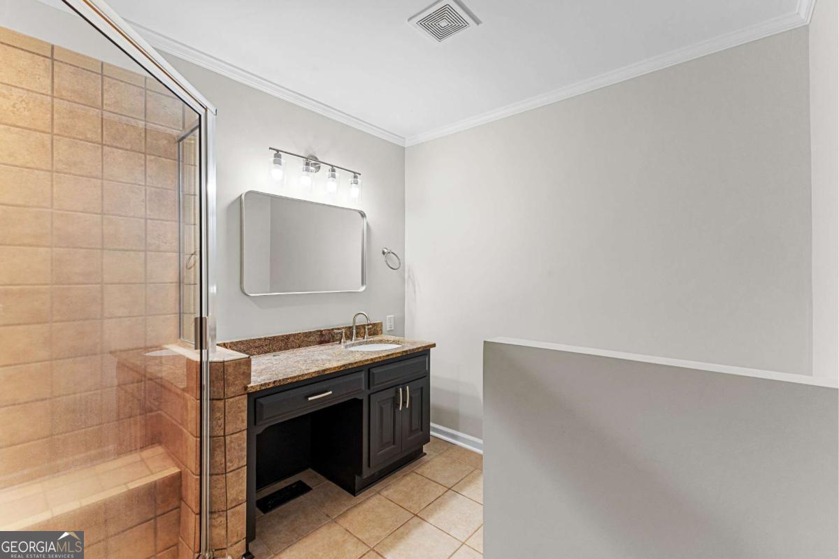 550 Davis Road Fayetteville, GA 30215 - Photo 36 of 75 a bathroom with a sink and a mirror