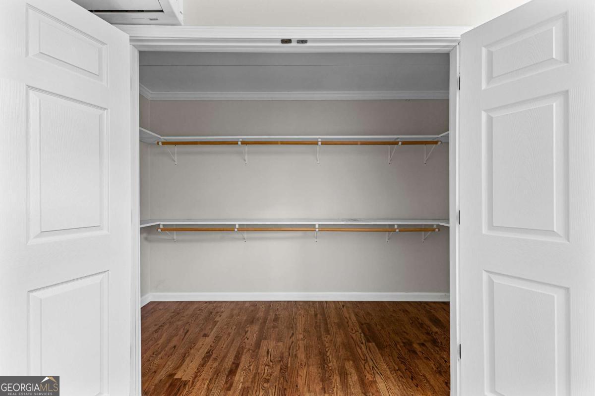 550 Davis Road Fayetteville, GA 30215 - Photo 39 of 75 a view of walk in closet with empty racks