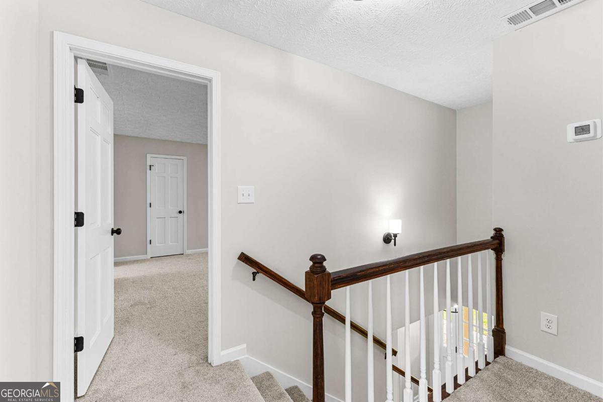 550 Davis Road Fayetteville, GA 30215 - Photo 41 of 75 a view of a hallway view with staircase