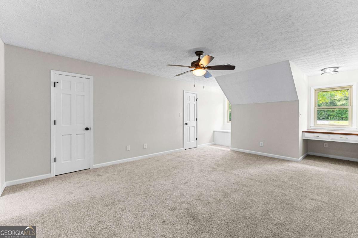 550 Davis Road Fayetteville, GA 30215 - Photo 42 of 75 a view of an empty room with a window