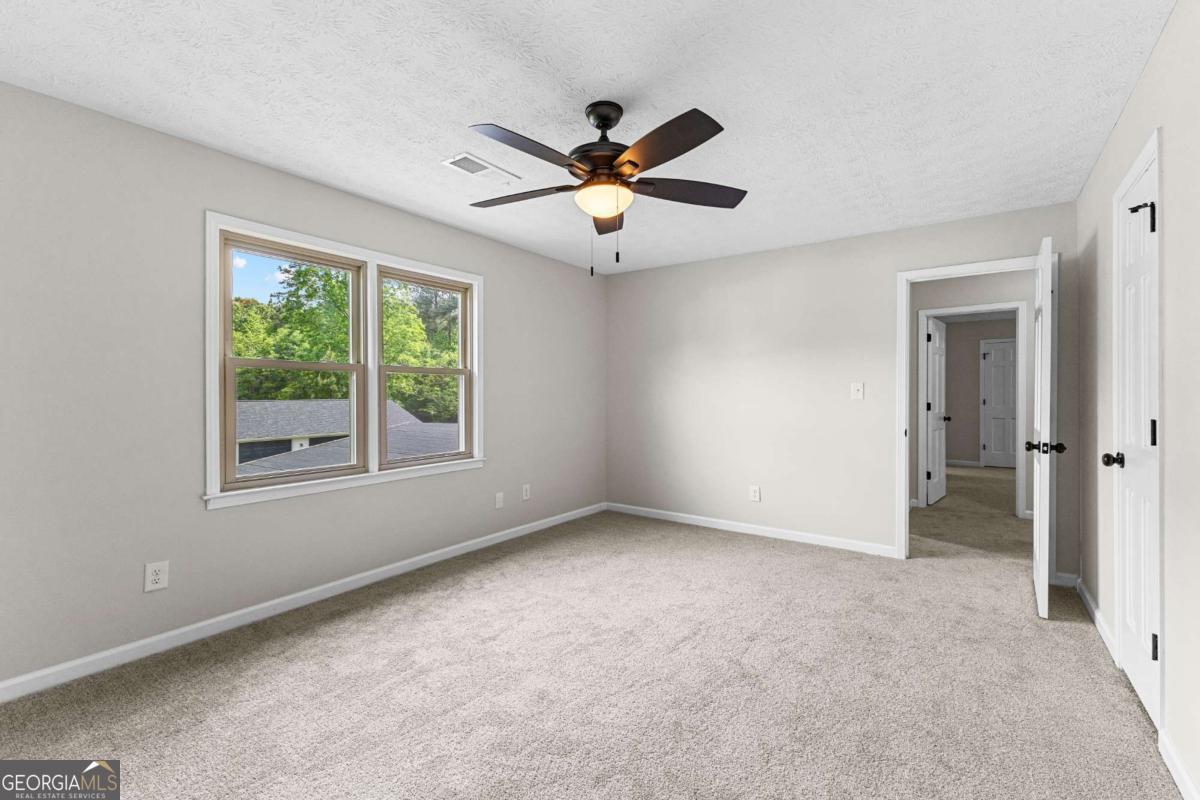 550 Davis Road Fayetteville, GA 30215 - Photo 50 of 75 a view of an empty room with a window