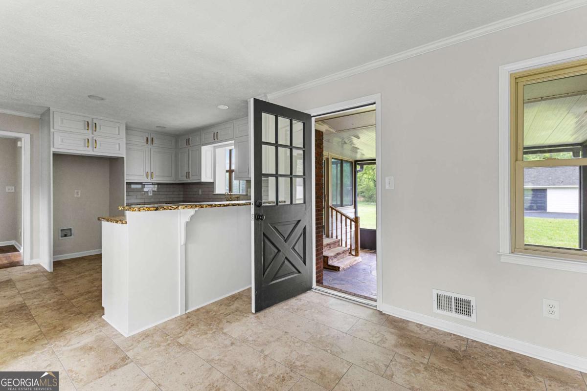 550 Davis Road Fayetteville, GA 30215 - Photo 56 of 75 a kitchen with a refrigerator and windows