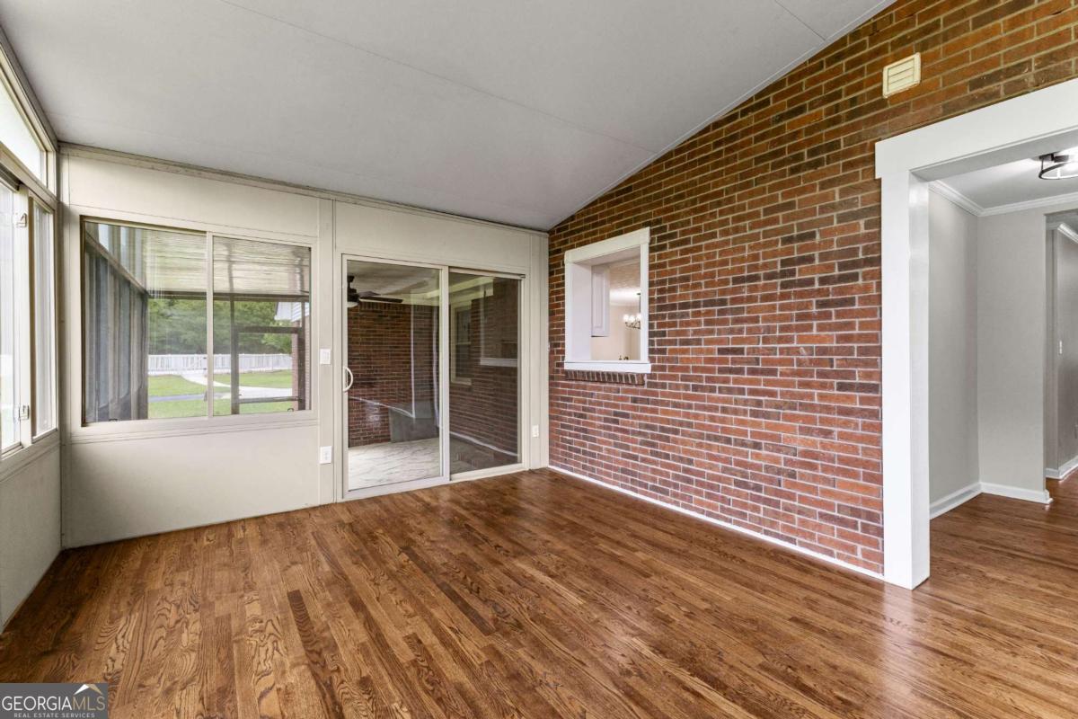 550 Davis Road Fayetteville, GA 30215 - Photo 58 of 75 a view of an empty room with wooden floor and a window
