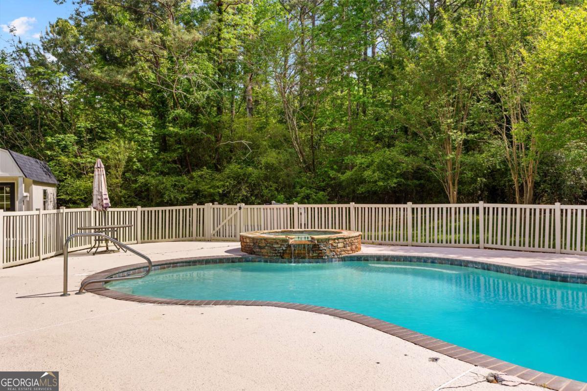 550 Davis Road Fayetteville, GA 30215 - Photo 70 of 75 a view of a deck with a yard and fence