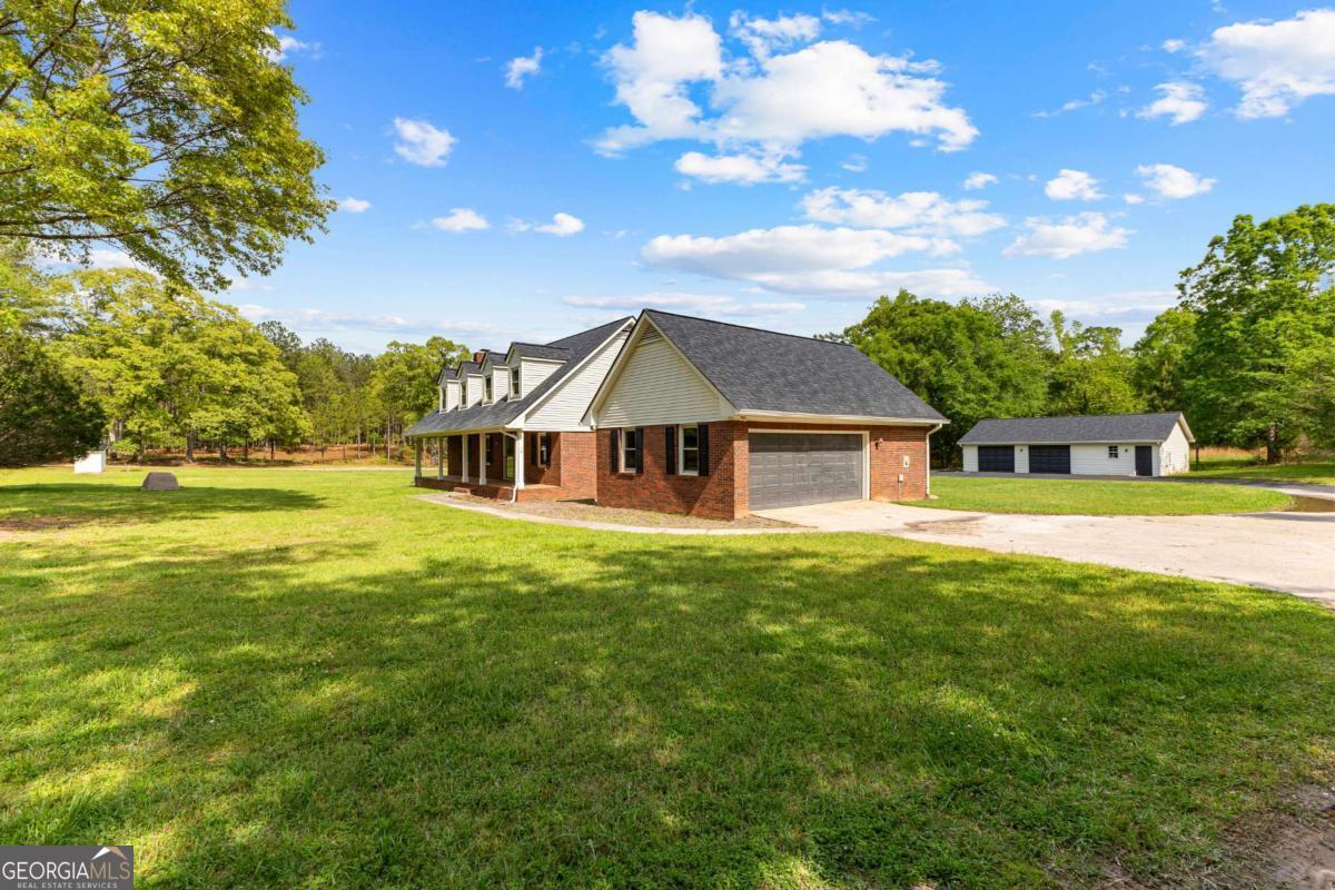 550 Davis Road Fayetteville, GA 30215 - Photo 75 of 75 a front view of a house with a garden
