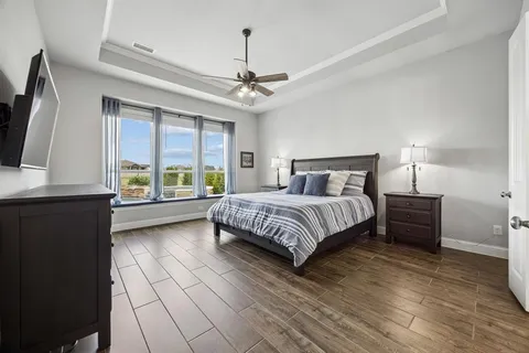 a bedroom with a large bed and a window