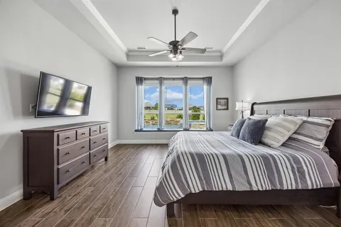 a bedroom with a bed and a dresser