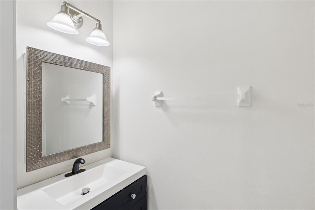 5001 Barnstead Drive Riverview, FL 33578 - Photo 15 of 37 a bathroom with a sink and a mirror