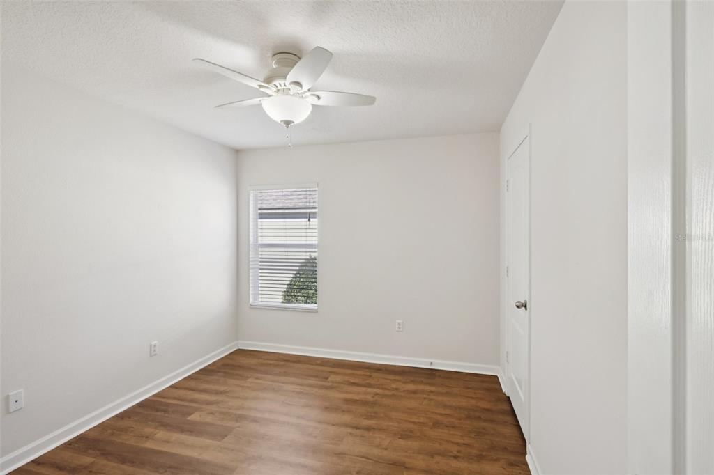 5001 Barnstead Drive Riverview, FL 33578 - Photo 16 of 37 a view of an empty room with wooden floor and a window