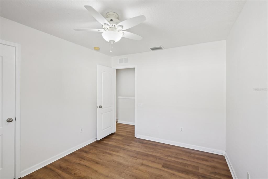 5001 Barnstead Drive Riverview, FL 33578 - Photo 17 of 37 a view of an empty room with wooden floor