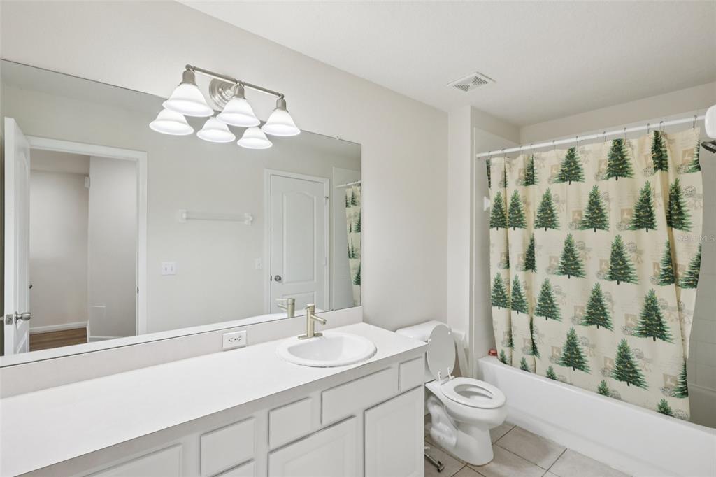 5001 Barnstead Drive Riverview, FL 33578 - Photo 20 of 37 a bathroom with a double vanity sink mirror and toilet