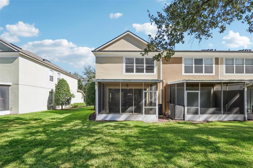 5001 Barnstead Drive Riverview, FL 33578 - Photo 30 of 37 a view of a brick house with a large windows and a yard with plants and large windows