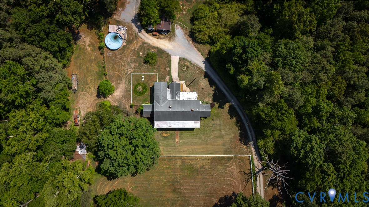6243 Studley Road Mechanicsville, VA 23116 - Photo 64 of 65 a view of a house with a swimming pool and a garden