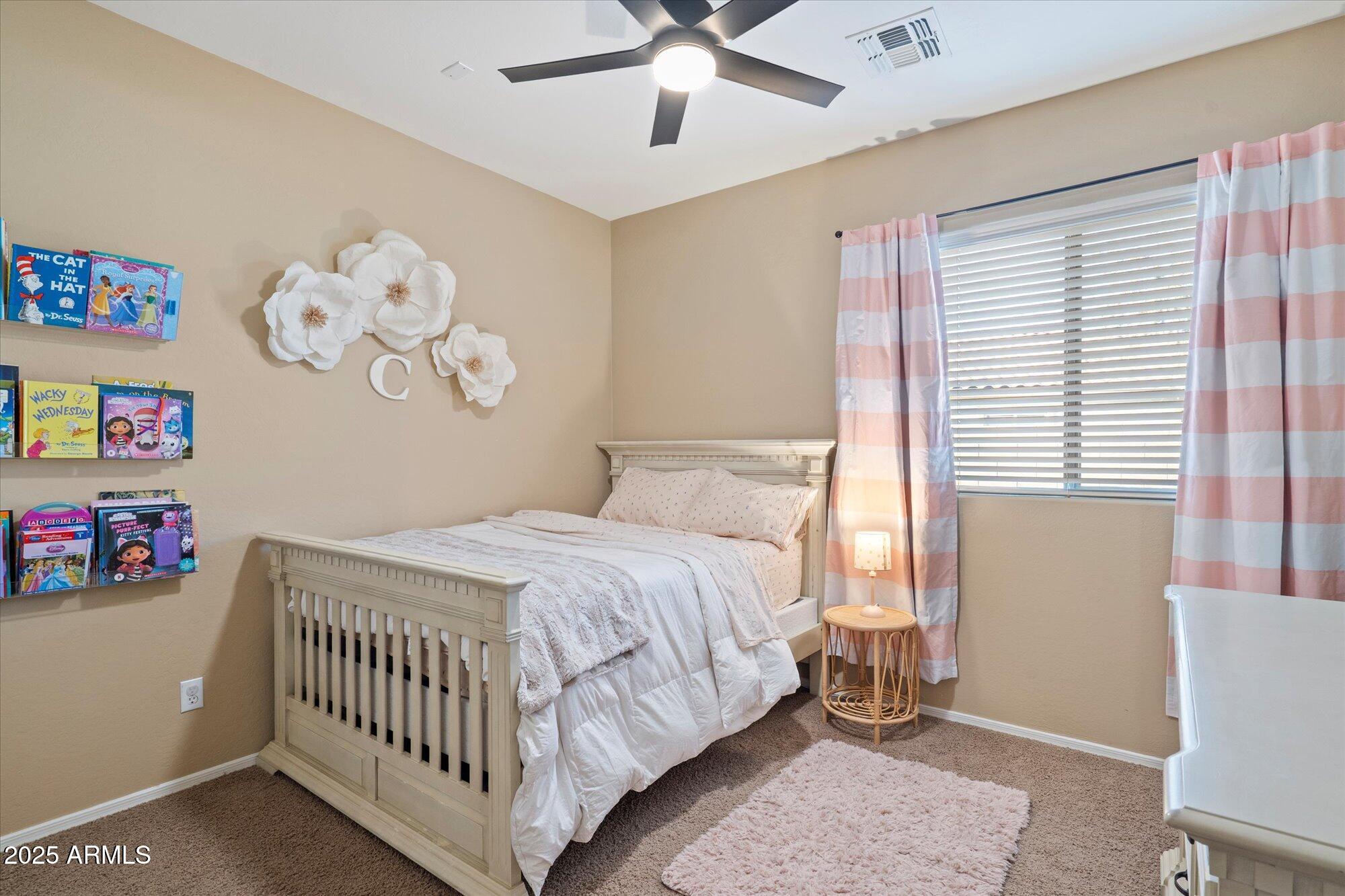 6710 South Seton Avenue Gilbert, AZ 85298 - Photo 29 of 51 a bedroom with a bed and a window