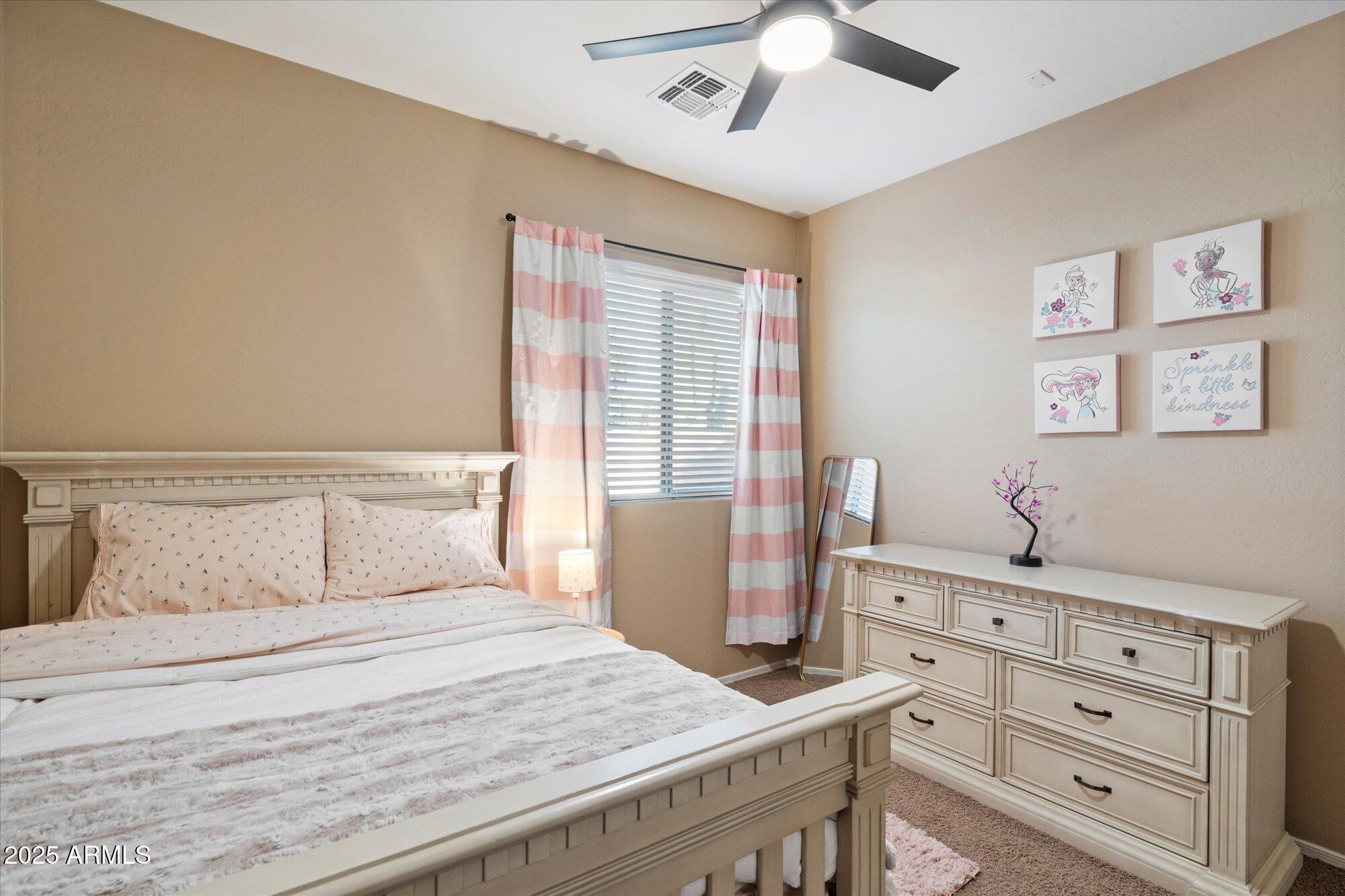 6710 South Seton Avenue Gilbert, AZ 85298 - Photo 30 of 51 a bedroom with a bed and a dresser