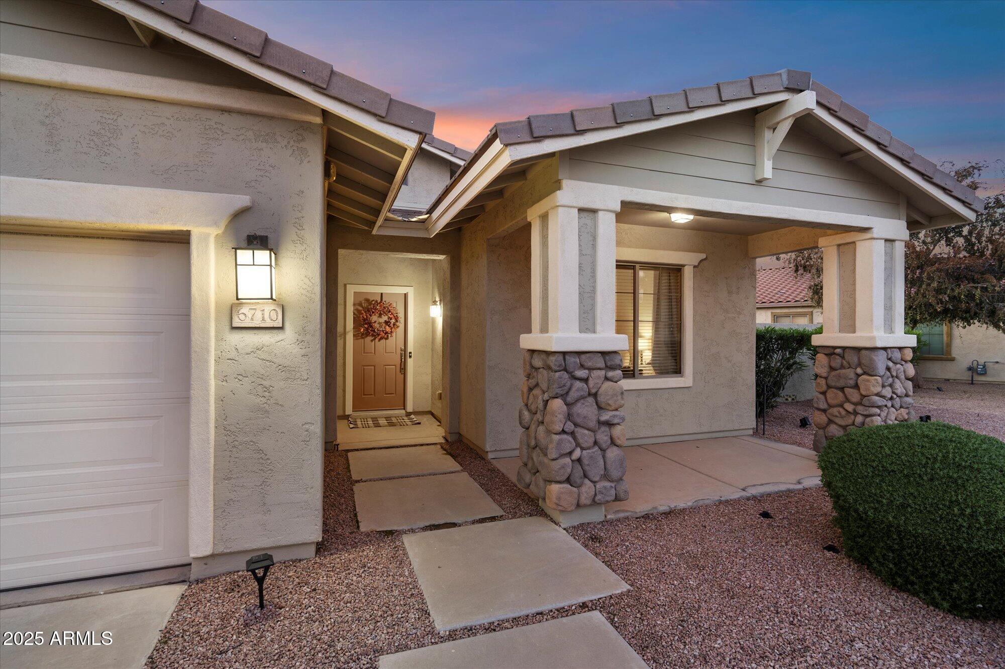 6710 South Seton Avenue Gilbert, AZ 85298 - Photo 3 of 51 a front view of a house