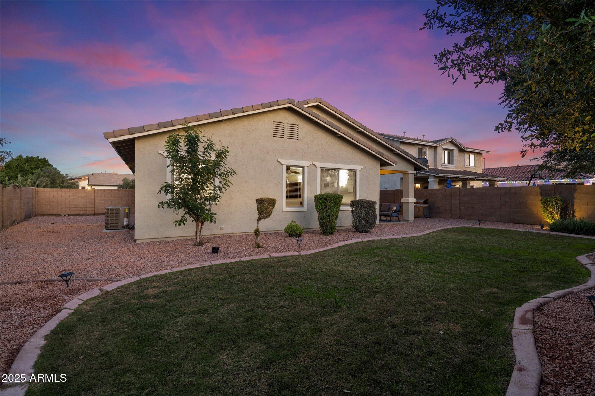 6710 South Seton Avenue Gilbert, AZ 85298 - Photo 37 of 51 a view of a house with backyard and garden