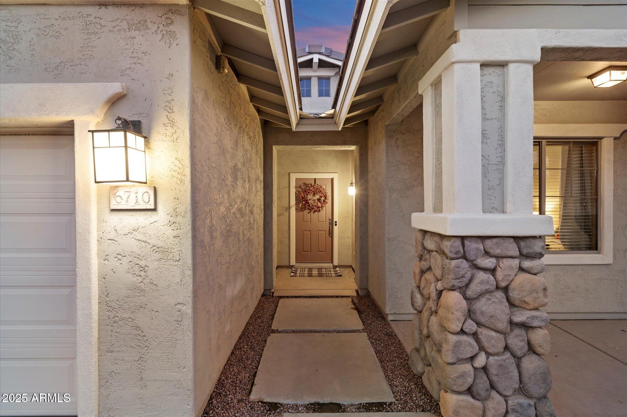 6710 South Seton Avenue Gilbert, AZ 85298 - Photo 4 of 51 a view of an entryway