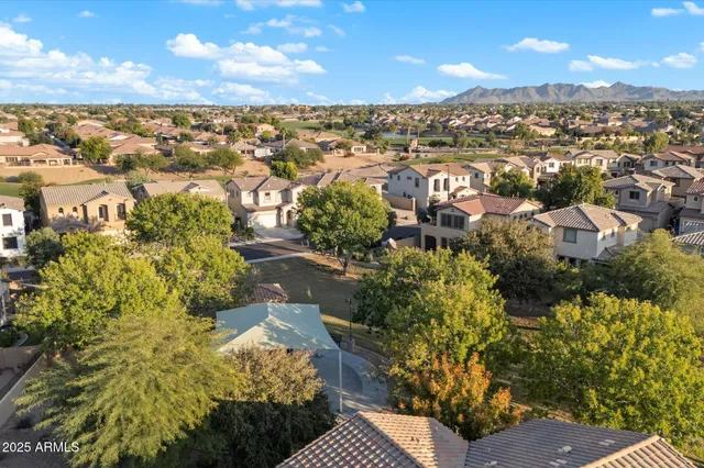 an aerial view of residential houses with outdoor space