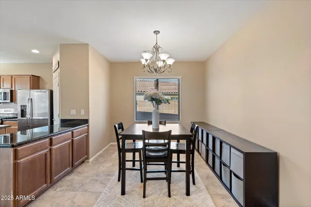 a view of a dining room with furniture and window