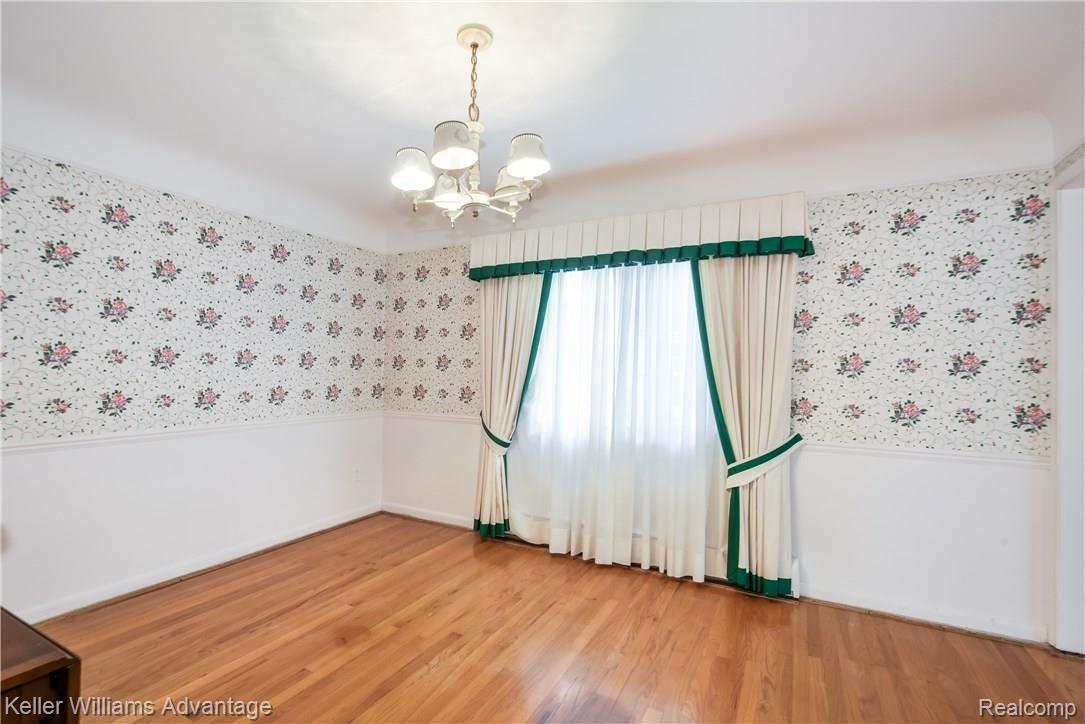 Formal Dining Room with Hardwood Floors, flows into the formal Living Room