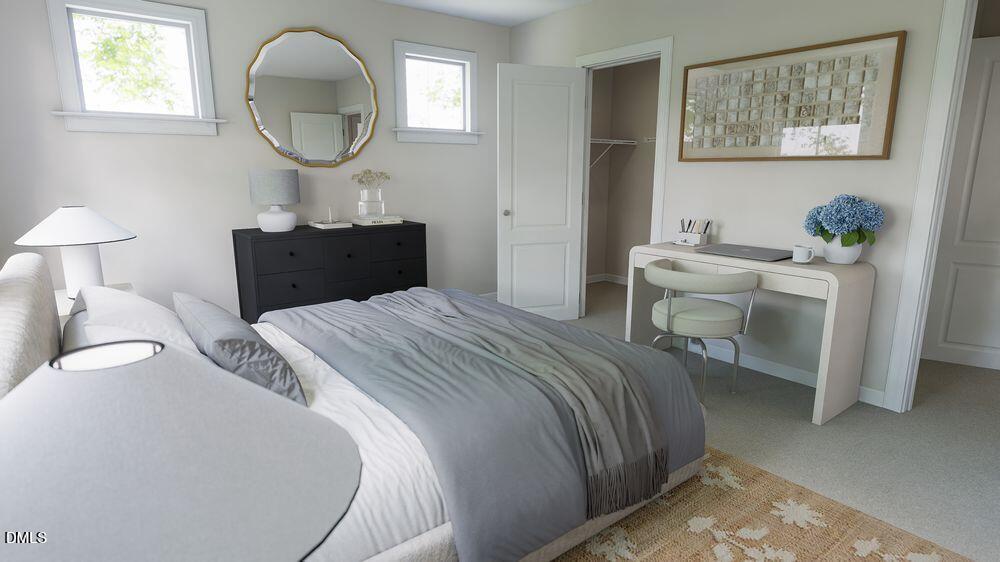 740 Bolera Road Knightdale, NC 27545 - Photo 16 of 32 a bedroom with a bed and a mirror