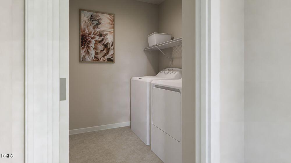 740 Bolera Road Knightdale, NC 27545 - Photo 17 of 32 a utility room with dryer and washer