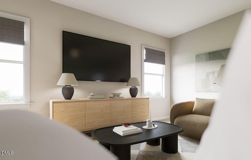 740 Bolera Road Knightdale, NC 27545 - Photo 10 of 32 a living room with furniture and a flat screen tv