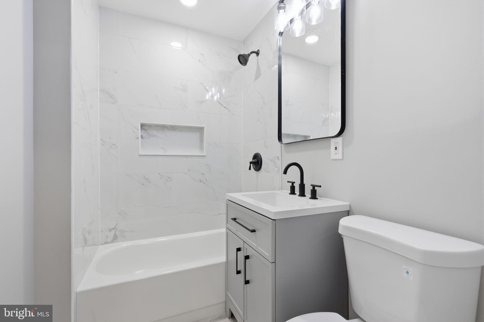 340 West Broad Street Hatfield, PA 19440 - Photo 29 of 55 a bathroom with a toilet sink and mirror