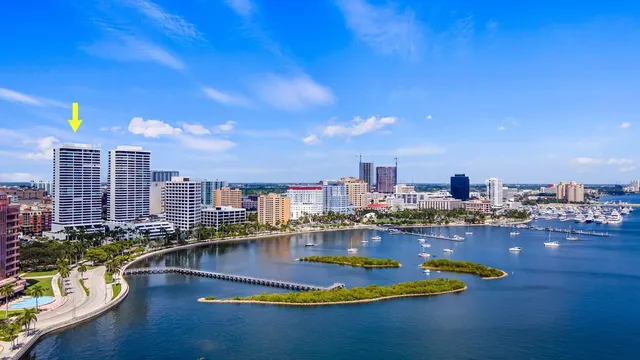a swimming pool with outdoor seating and city view