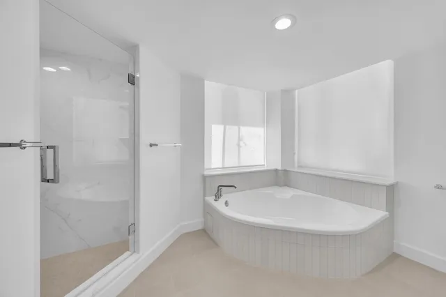 a white bath tub sitting in a bathroom
