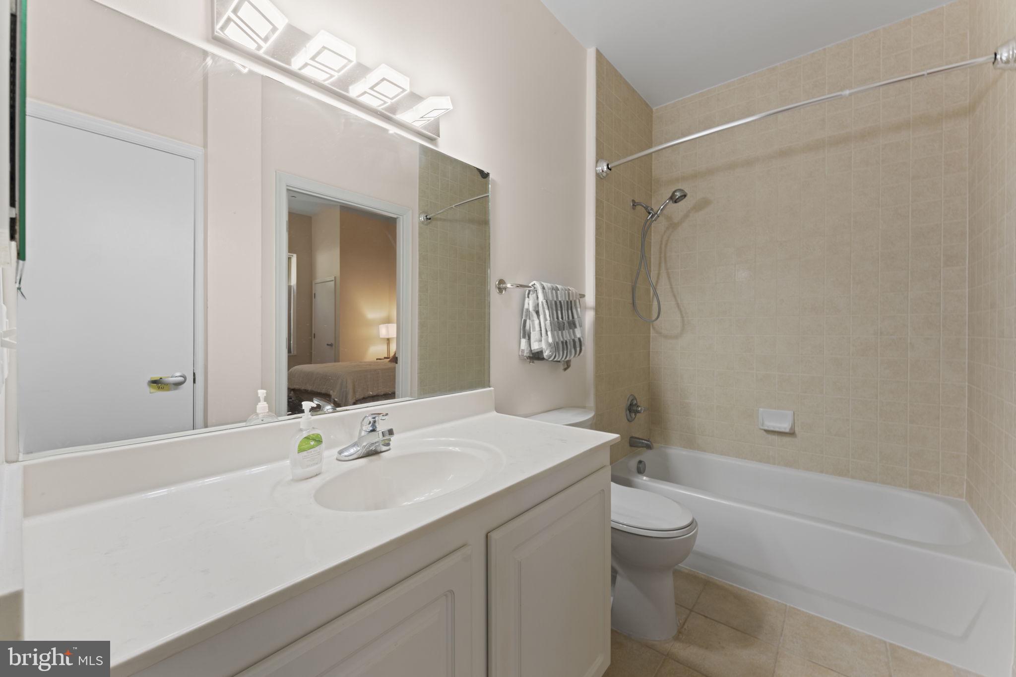 355 I Street Southwest, Unit S104 Washington, DC 20024 - Photo 19 of 64 a bathroom with a sink a toilet and shower