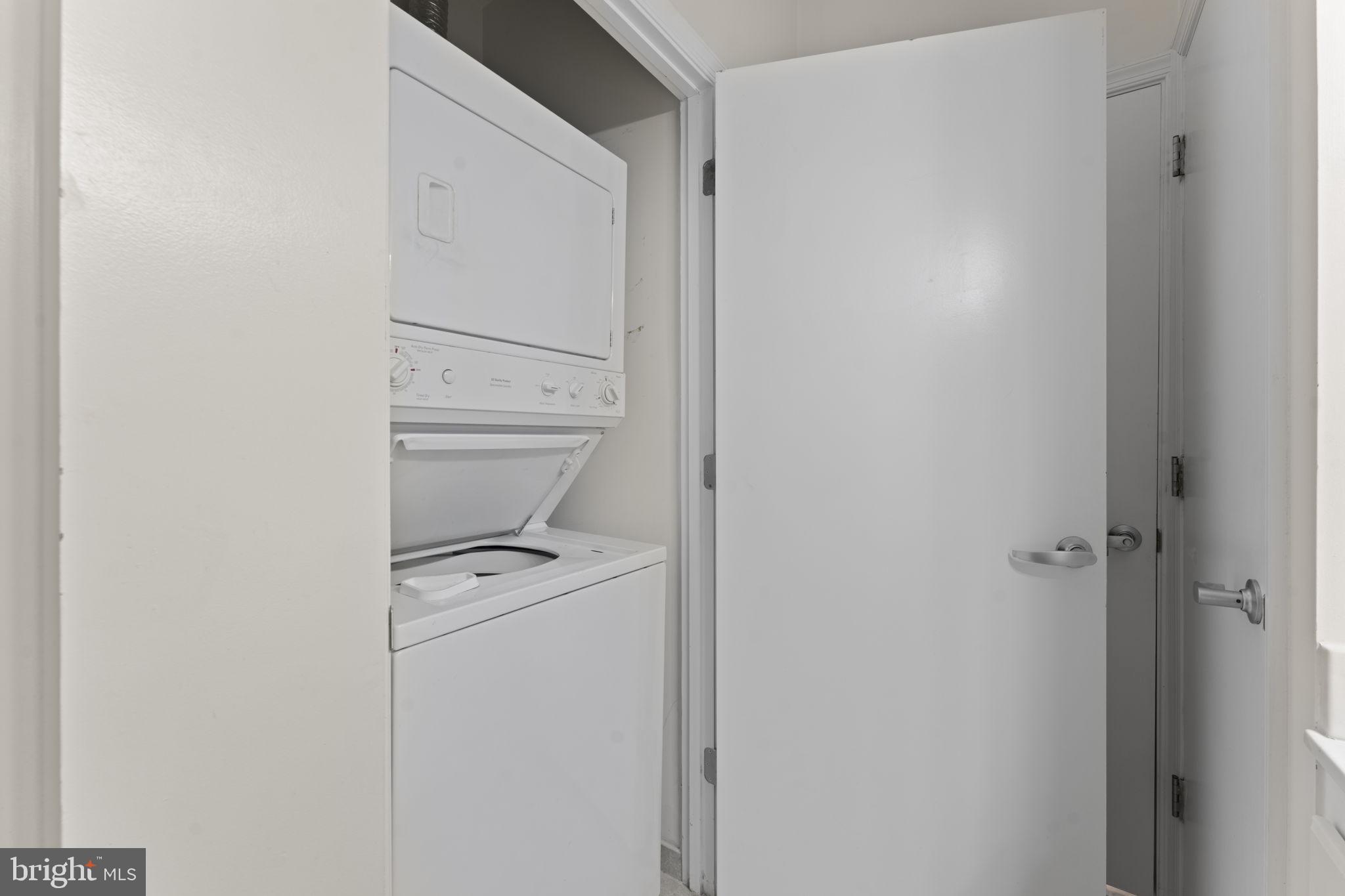 355 I Street Southwest, Unit S104 Washington, DC 20024 - Photo 22 of 64 a utility room with dryer and washer