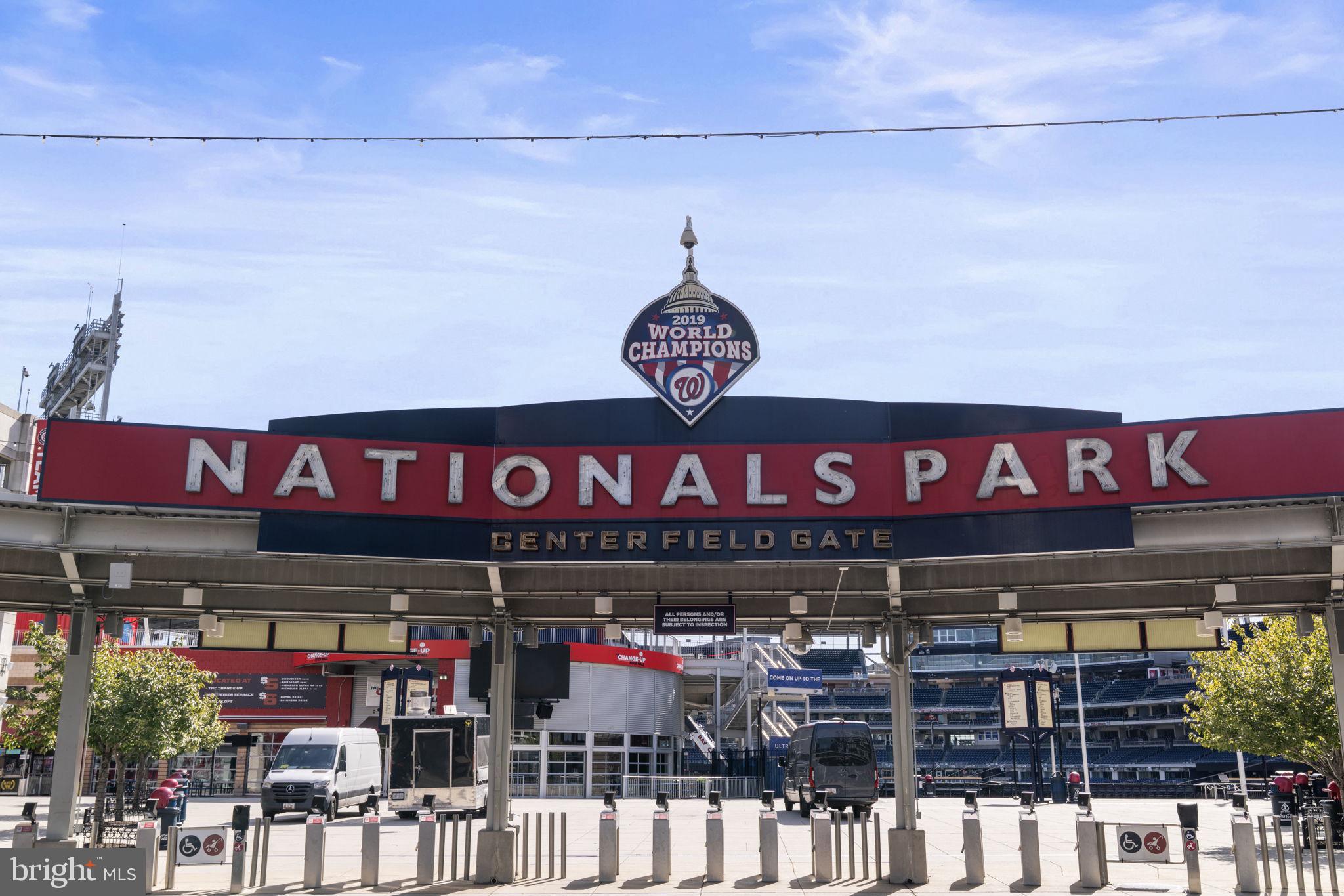 355 I Street Southwest, Unit S104 Washington, DC 20024 - Photo 40 of 64 a view of a store with a lot of street signs