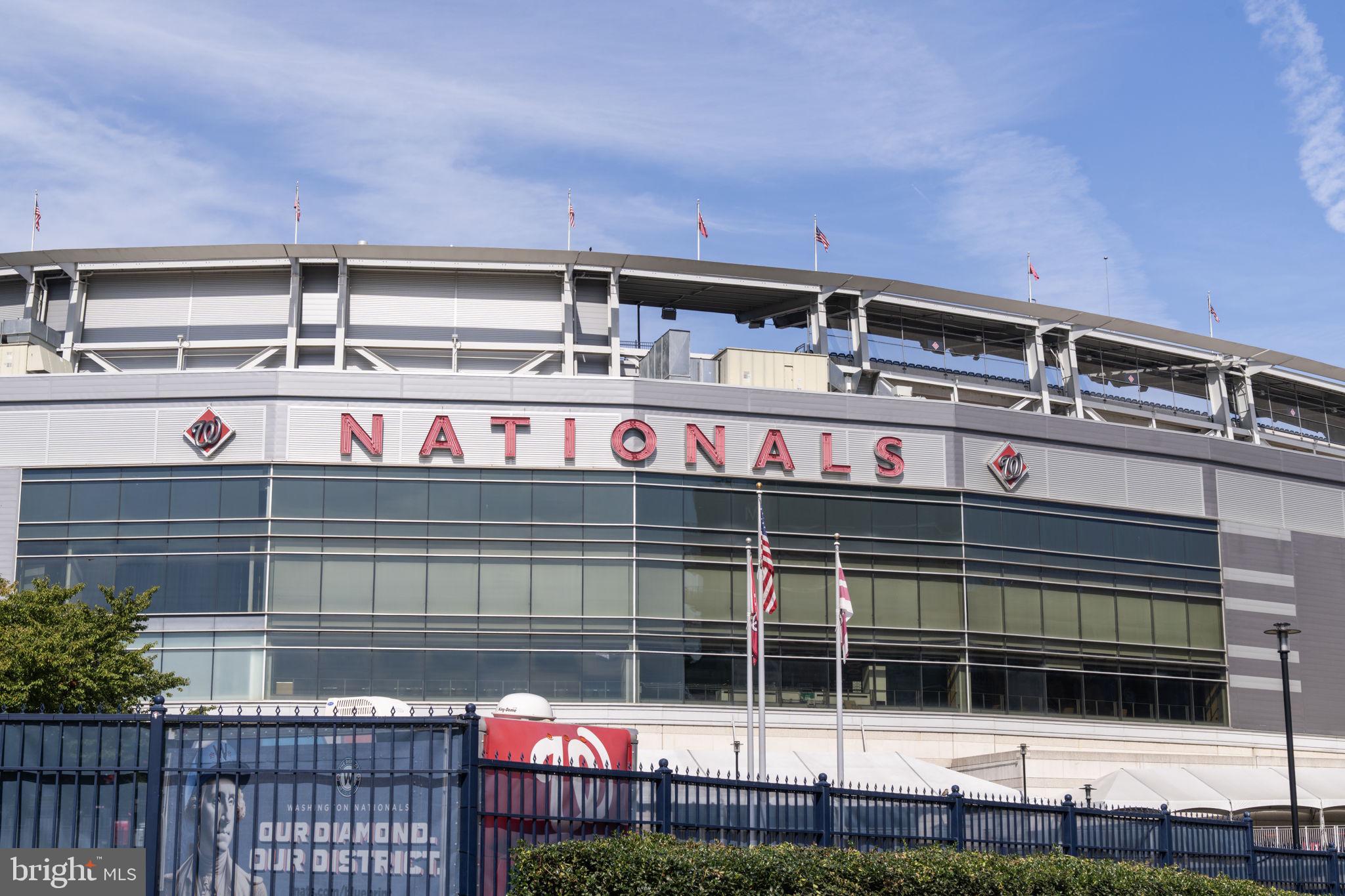 355 I Street Southwest, Unit S104 Washington, DC 20024 - Photo 53 of 64 a front view of a building with a garden